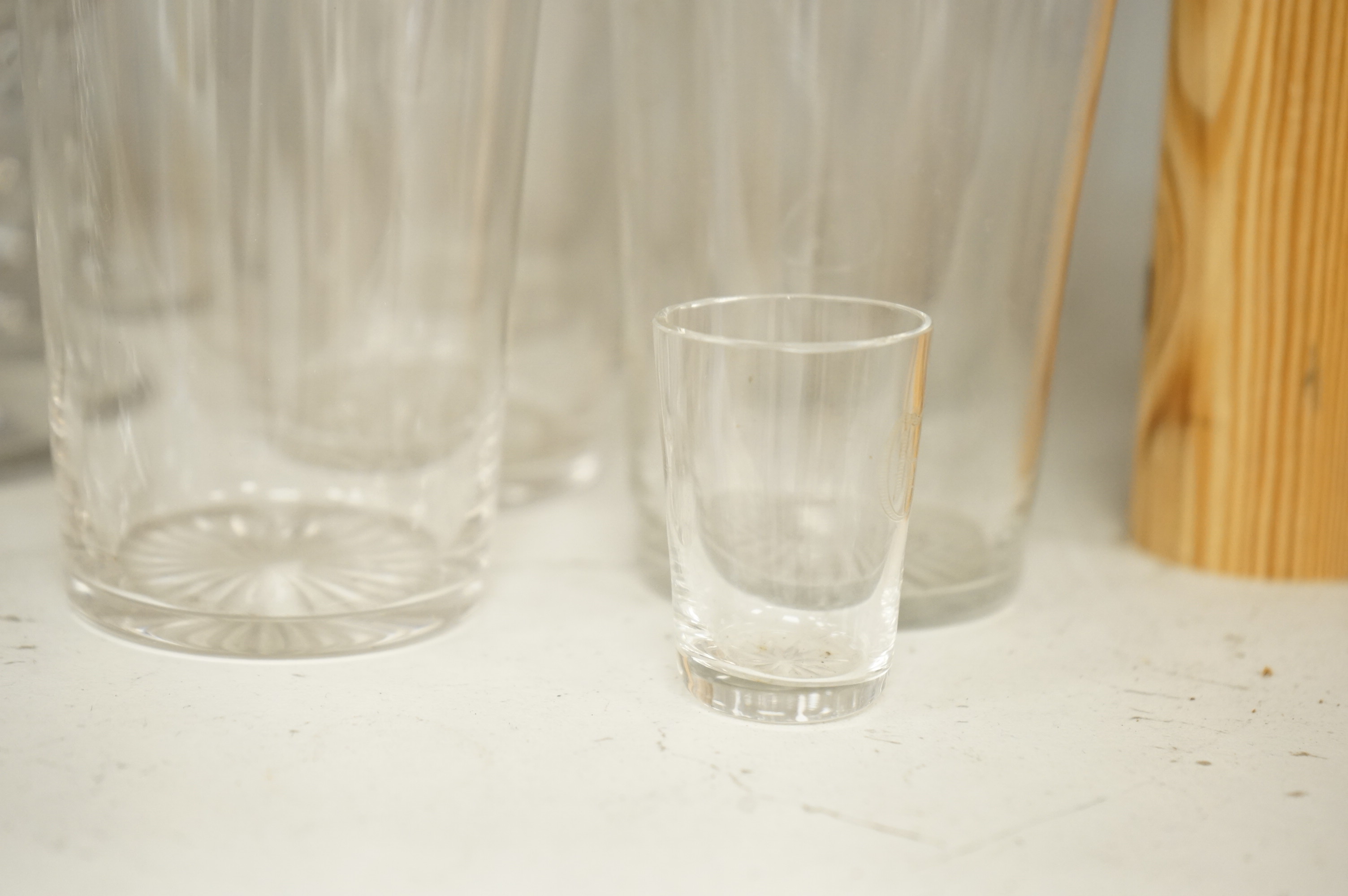 A pair of engraved glass goblets, seven tumblers engraved with the initial G and an air twist stem wine glass, etc. (12)